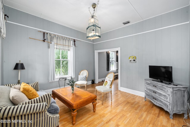 10 Venancio St, Saint Augustine, FL 32084 - living room with light wood-style flooring and baseboards