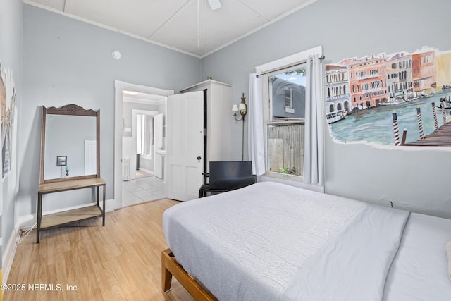 10 Venancio St, Saint Augustine, FL 32084 - bedroom with wood finished floors, ornamental molding, ensuite bathroom, and a ceiling fan