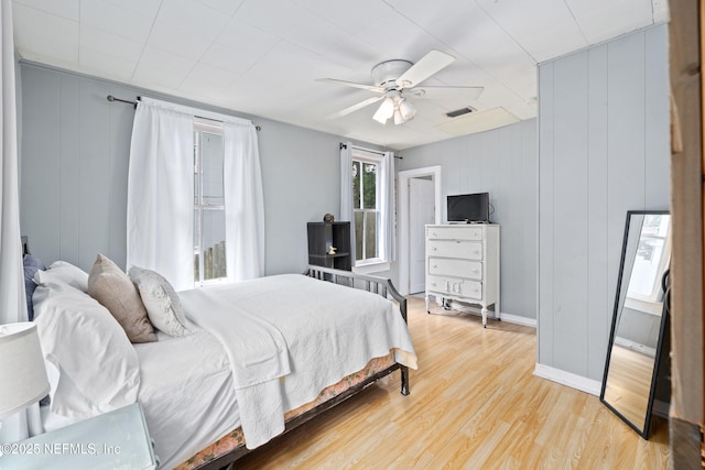 10 Venancio St, Saint Augustine, FL 32084 - bedroom featuring light wood-style flooring, a decorative wall, and ceiling fan
