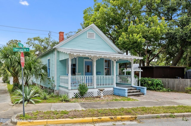 10 Venancio St, Saint Augustine, FL 32084 - view of front of home featuring covered porch and a chimney