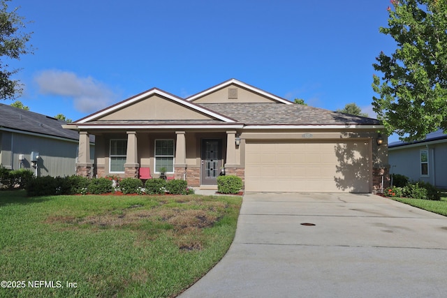 127 Colorado Springs Way, Saint Augustine, FL 32092 - view of front facade with stucco siding, a front lawn, concrete driveway, an attached garage, and stone siding
