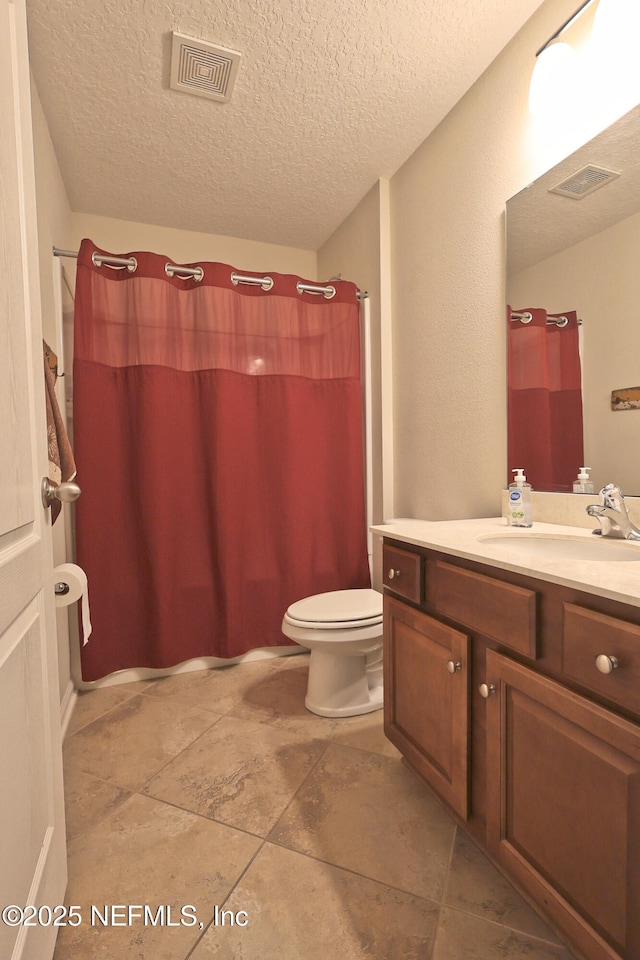 127 Colorado Springs Way, Saint Augustine, FL 32092 - bathroom featuring vanity, curtained shower, and a textured ceiling
