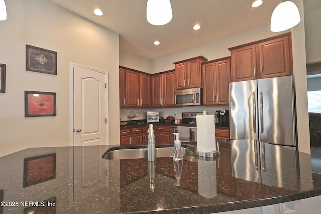 127 Colorado Springs Way, Saint Augustine, FL 32092 - kitchen with stainless steel appliances, recessed lighting, dark stone counters, and pendant lighting
