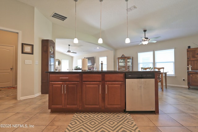 127 Colorado Springs Way, Saint Augustine, FL 32092 - kitchen with stainless steel dishwasher, ceiling fan, vaulted ceiling, light tile patterned flooring, and dark countertops