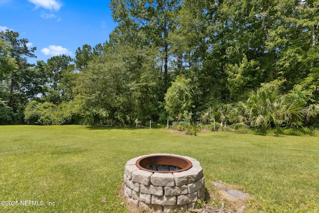 86385 Peeples Rd, Yulee, FL 32097 - view of grassy yard with an outdoor fire pit