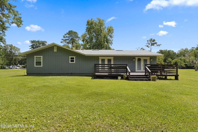 86385 Peeples Rd, Yulee, FL 32097 - back of house featuring french doors, a wooden deck, and a yard