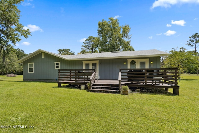 86385 Peeples Rd, Yulee, FL 32097 - rear view of house featuring a deck, a yard, and french doors