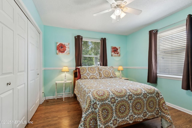 86385 Peeples Rd, Yulee, FL 32097 - bedroom featuring a closet, wood finished floors, a ceiling fan, and a textured ceiling