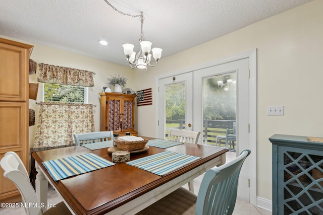 86385 Peeples Rd, Yulee, FL 32097 - dining area with a chandelier, healthy amount of natural light, recessed lighting, a textured ceiling, and french doors