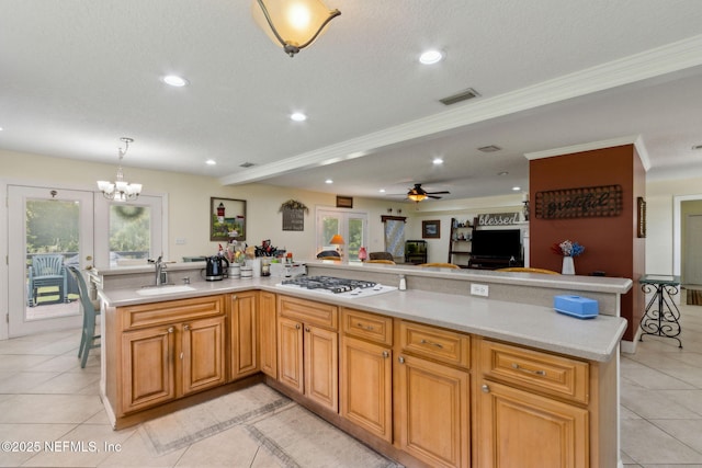 86385 Peeples Rd, Yulee, FL 32097 - kitchen with white gas stovetop, recessed lighting, light countertops, light tile patterned floors, and a chandelier