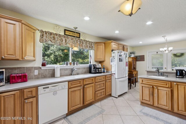 86385 Peeples Rd, Yulee, FL 32097 - kitchen featuring white appliances, plenty of natural light, a chandelier, light countertops, and recessed lighting