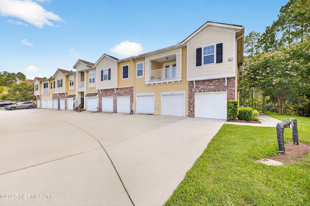 218 Larkin Pl Unit 105, Saint Johns, FL 32259 - view of property featuring a residential view, a front lawn, concrete driveway, brick siding, and a garage