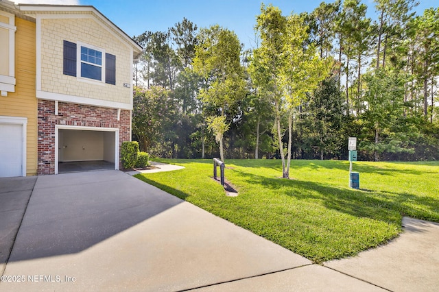 218 Larkin Pl Unit 105, Saint Johns, FL 32259 - view of property exterior with driveway, a lawn, a garage, brick siding, and view of scattered trees