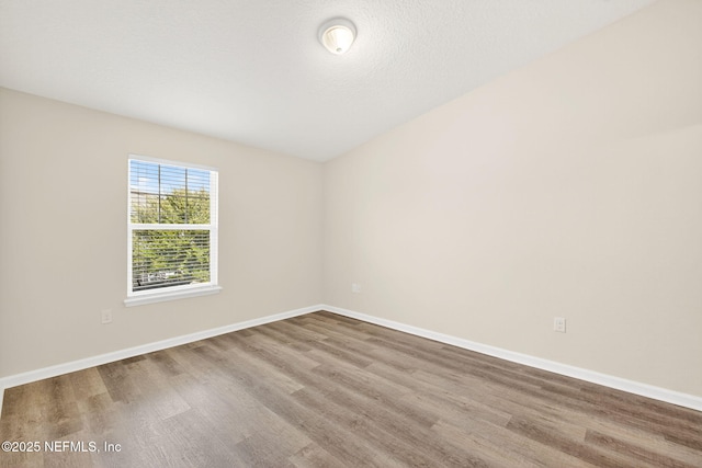 218 Larkin Pl Unit 105, Saint Johns, FL 32259 - unfurnished room featuring wood finished floors and baseboards