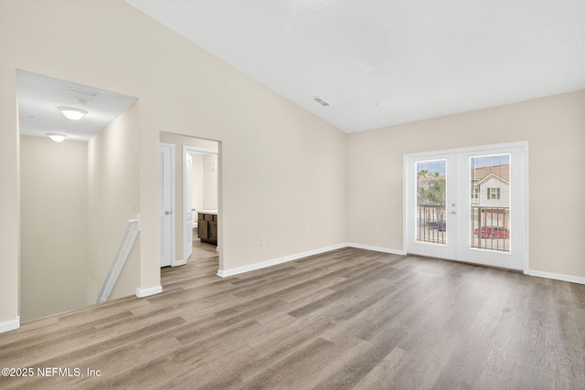 218 Larkin Pl Unit 105, Saint Johns, FL 32259 - unfurnished living room with wood finished floors and french doors