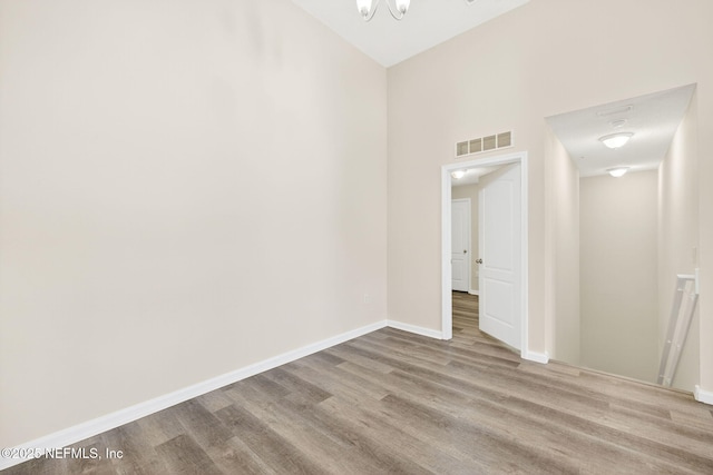 218 Larkin Pl Unit 105, Saint Johns, FL 32259 - spare room with wood finished floors and a chandelier