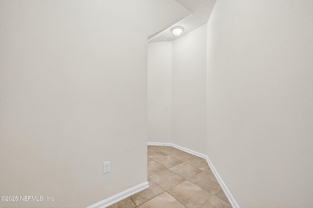 218 Larkin Pl Unit 105, Saint Johns, FL 32259 - walk in closet featuring light tile patterned floors