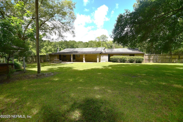 44186 Lee Dr, Callahan, FL 32011 - back of house featuring a fenced backyard