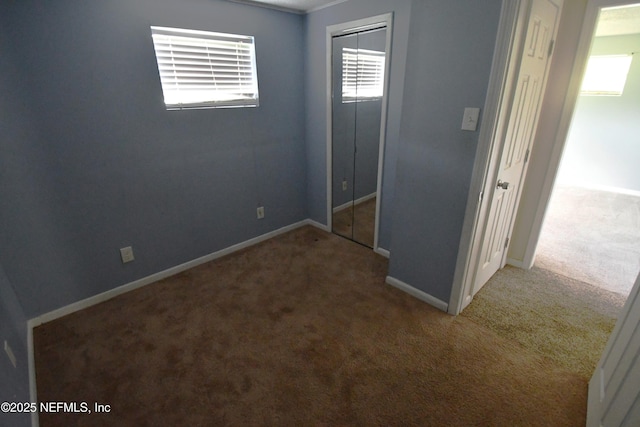 44186 Lee Dr, Callahan, FL 32011 - unfurnished bedroom featuring carpet and a closet