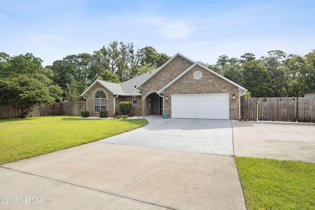 4804 Winton Cir, Saint Augustine, FL 32086 - view of front of house featuring driveway, a garage, and brick siding