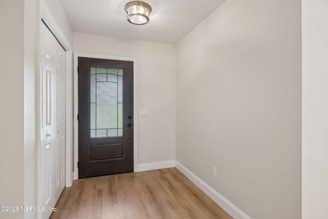 4804 Winton Cir, Saint Augustine, FL 32086 - entrance foyer with light wood-style flooring and a textured ceiling