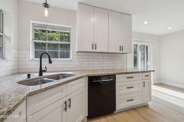 4804 Winton Cir, Saint Augustine, FL 32086 - kitchen with dishwasher, healthy amount of natural light, backsplash, white cabinets, and recessed lighting