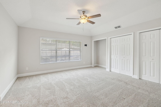 4804 Winton Cir, Saint Augustine, FL 32086 - unfurnished bedroom with carpet, multiple closets, and ceiling fan