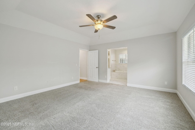 4804 Winton Cir, Saint Augustine, FL 32086 - unfurnished bedroom featuring light carpet, multiple windows, and ensuite bath