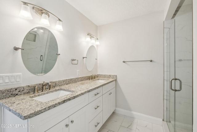 4804 Winton Cir, Saint Augustine, FL 32086 - bathroom featuring marble finish floors, double vanity, and a marble finish shower