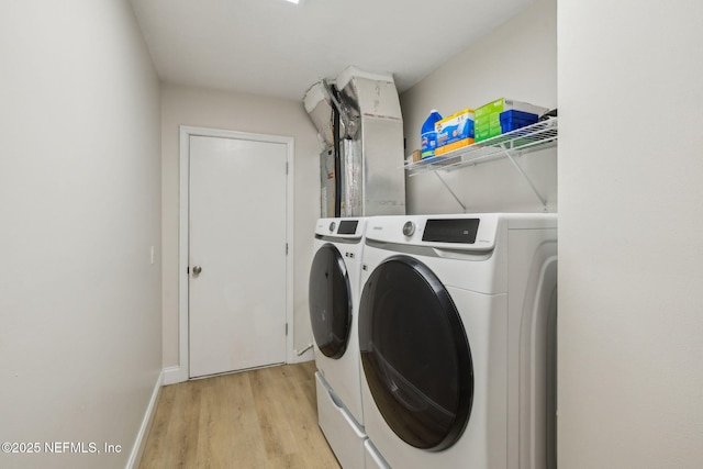4804 Winton Cir, Saint Augustine, FL 32086 - laundry room with separate washer and dryer and light wood-type flooring
