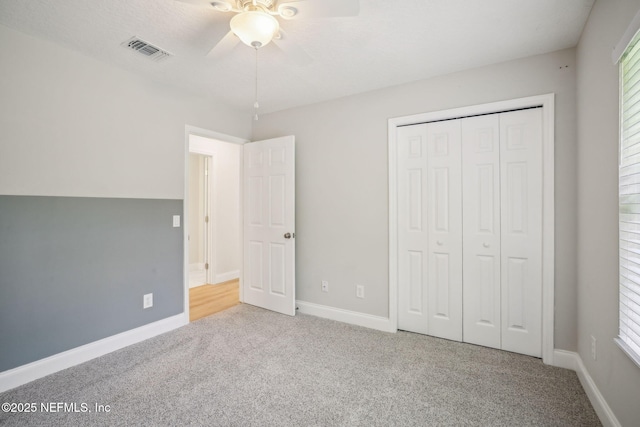 4804 Winton Cir, Saint Augustine, FL 32086 - unfurnished bedroom featuring carpet flooring, a closet, and ceiling fan