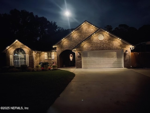 4804 Winton Cir, Saint Augustine, FL 32086 - view of front facade featuring brick siding, concrete driveway, and an attached garage
