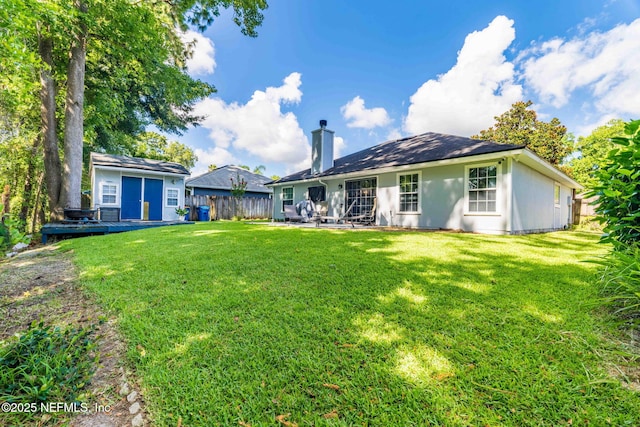 1133 Blue Sky Way, Jacksonville, FL 32225 - back of property with a chimney and a wooden deck