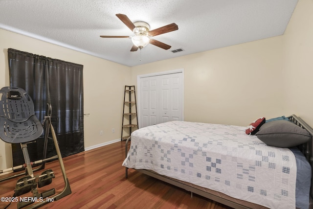 1133 Blue Sky Way, Jacksonville, FL 32225 - bedroom with wood finished floors, a closet, ceiling fan, and a textured ceiling