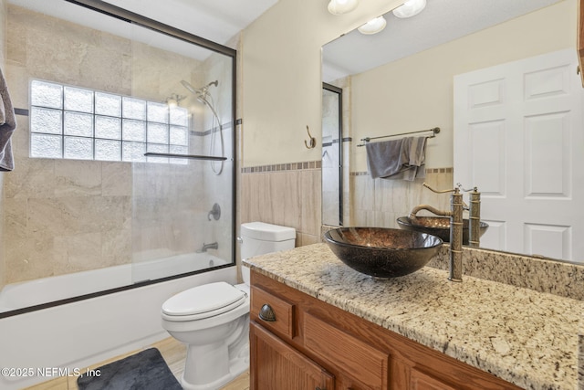 1133 Blue Sky Way, Jacksonville, FL 32225 - bathroom with vanity, tile walls, and shower / bath combination with glass door