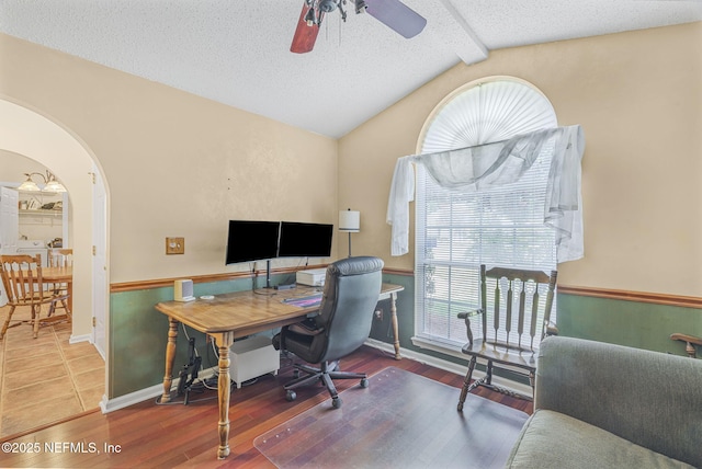 1133 Blue Sky Way, Jacksonville, FL 32225 - home office featuring plenty of natural light, ceiling fan, a textured ceiling, arched walkways, and wood finished floors