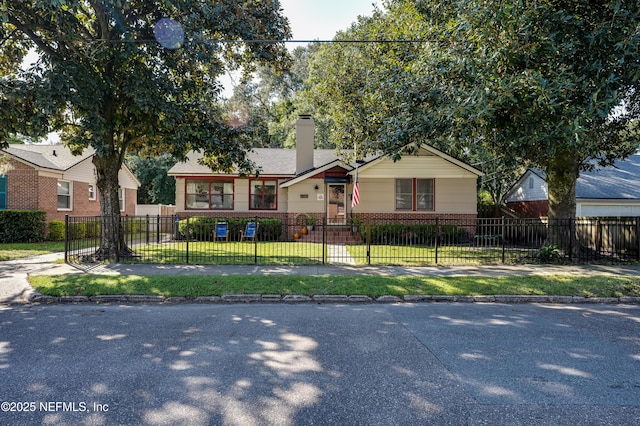 4818 Astral St, Jacksonville, FL 32205 - view of front of property with brick siding, a chimney, and a fenced front yard