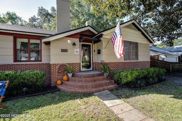4818 Astral St, Jacksonville, FL 32205 - view of front of home featuring brick siding and a chimney