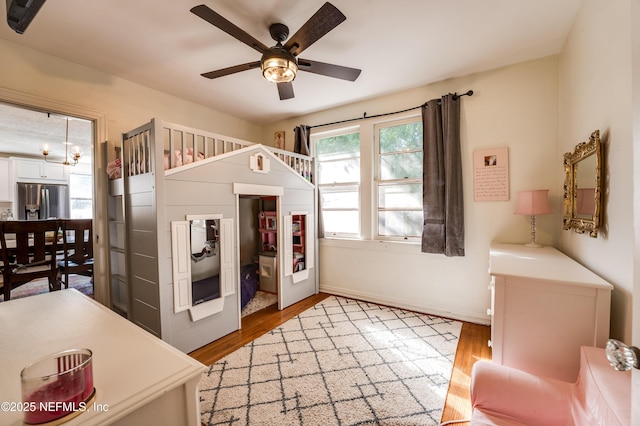 4818 Astral St, Jacksonville, FL 32205 - bedroom featuring stainless steel fridge with ice dispenser and light wood-type flooring