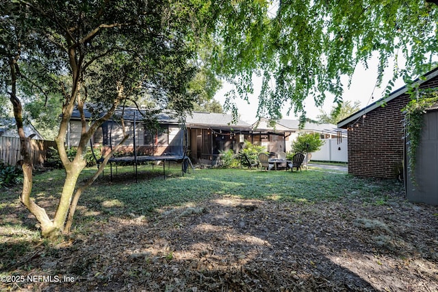 4818 Astral St, Jacksonville, FL 32205 - view of yard with a trampoline and a sunroom