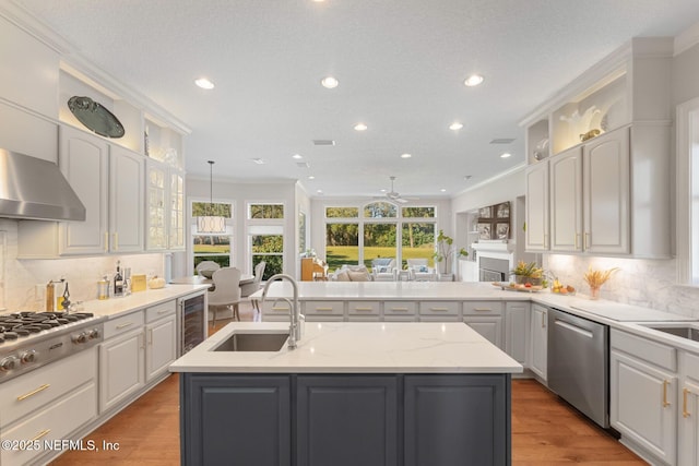 1614 Sheffield Park Ct, Jacksonville, FL 32225 - kitchen with wine cooler, appliances with stainless steel finishes, recessed lighting, backsplash, and a center island with sink