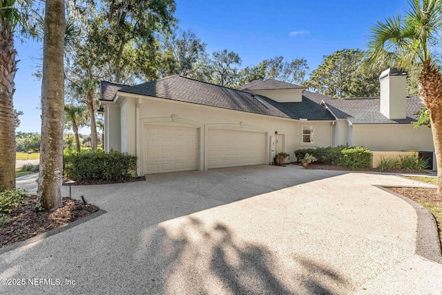 1614 Sheffield Park Ct, Jacksonville, FL 32225 - view of front of property featuring stucco siding, a garage, concrete driveway, a chimney, and a shingled roof