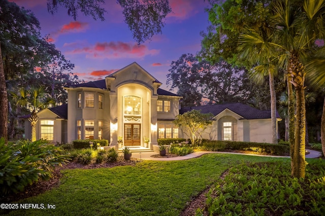 1614 Sheffield Park Ct, Jacksonville, FL 32225 - mediterranean / spanish-style home with french doors, stucco siding, and a yard