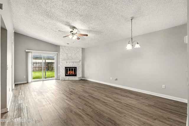 6719 Newgate Cir E, Jacksonville, FL 32244 - unfurnished living room with a ceiling fan, a textured ceiling, dark wood-style floors, a chandelier, and a fireplace