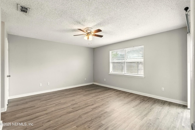 6719 Newgate Cir E, Jacksonville, FL 32244 - unfurnished room featuring ceiling fan, wood finished floors, and a textured ceiling