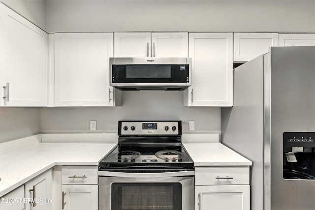 6719 Newgate Cir E, Jacksonville, FL 32244 - kitchen featuring appliances with stainless steel finishes and white cabinetry