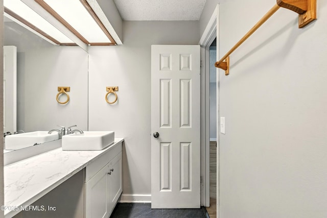 6719 Newgate Cir E, Jacksonville, FL 32244 - bathroom with baseboards and vanity