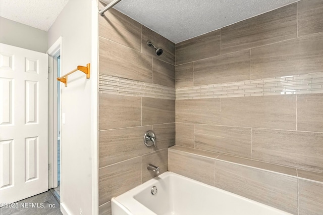 6719 Newgate Cir E, Jacksonville, FL 32244 - full bath featuring a textured ceiling and tub / shower combination