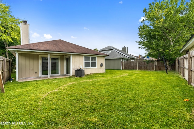 6719 Newgate Cir E, Jacksonville, FL 32244 - rear view of property featuring a chimney and a fenced backyard