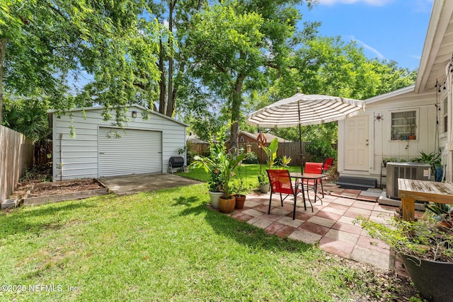 4737 College St, Jacksonville, FL 32205 - fenced backyard with an outdoor structure, a patio area, and a detached garage